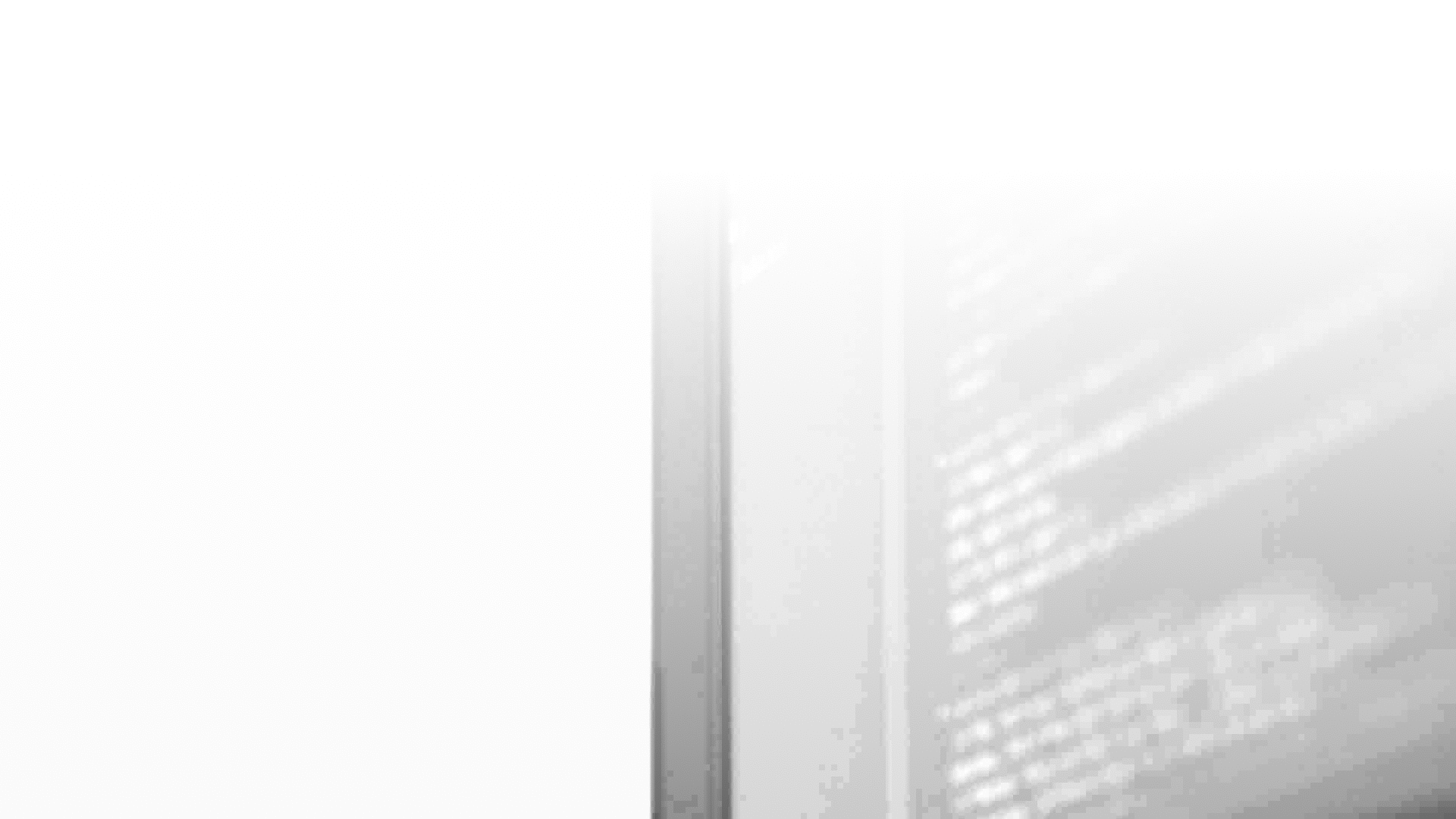A dark background image of a desktop monitor with a CSS code on it